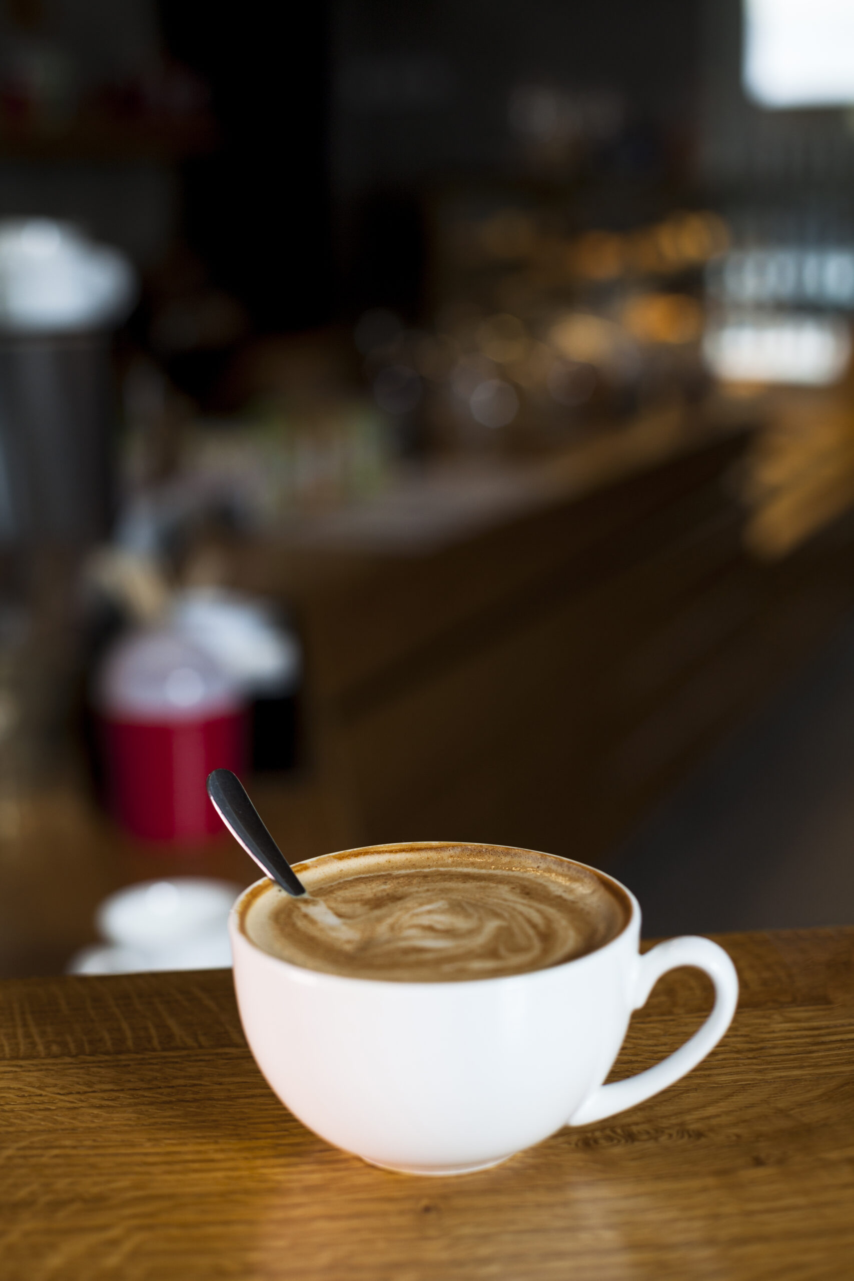 close-up-latte-coffee-cup-table